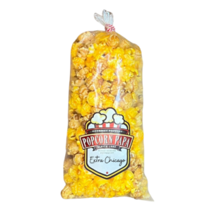 A bag of popcorn that is on the ground.