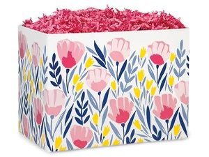 A pink and yellow floral basket filled with shredded paper.