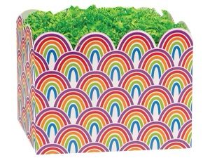 A rainbow basket with green grass in it.