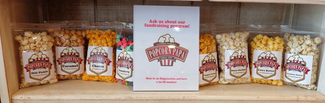 A card that says popcorn papa and the company logo.