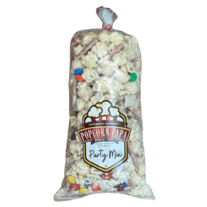 A bag of popcorn with candy on top with Transparent background